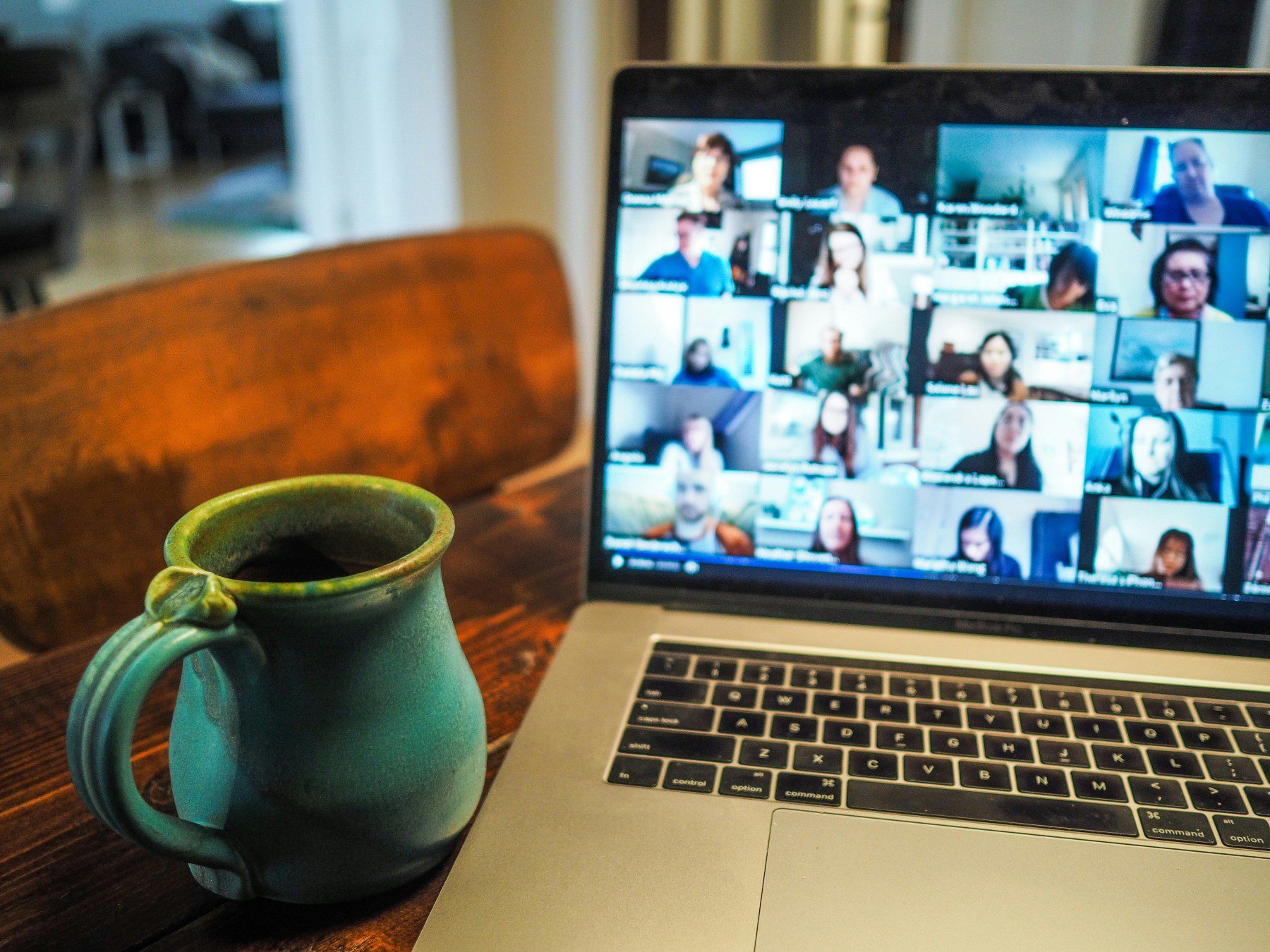 A laptop with people in a call